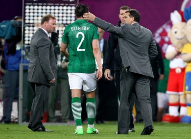 Marco Tardelli consoles goalscorer Sean St Ledger after Sunday night's defeat in Poznan.