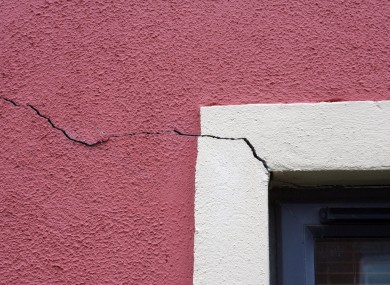 Cracks in the wall of a house affected by pyrite damage.