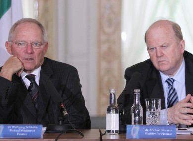 Wolfgang Schauble (left) speaks to reporters at Farmleigh after meeting with Michael Noonan and Brendan Howlin (out of picture).