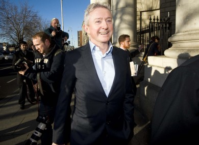 Louis Walsh smiles after the High Court was told of The Sun's settlement in a defamation claim.