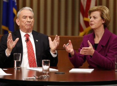 Tammy Baldwin (right) defeated her Republican rival Tommy Thompson (left) in a narrow election.