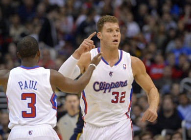Blake Griffin and Chris Paul celebrate a Clippers score.