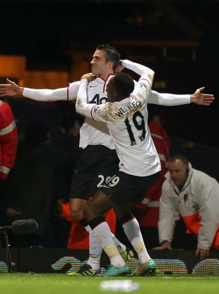 Van Persie celebrates scoring the equaliser against West Ham yesterday.