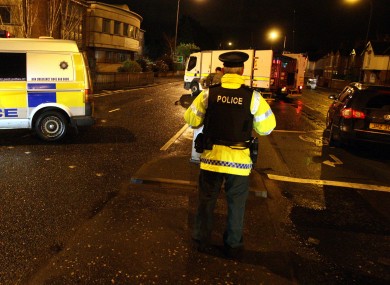 PSNI officers attend the scene at the Upper Newtownards Road on December 30, following the attempted bombing of a PSNI officer's family car.