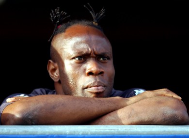 Taribo West of Partizan Belgrade watches the game from the stands.