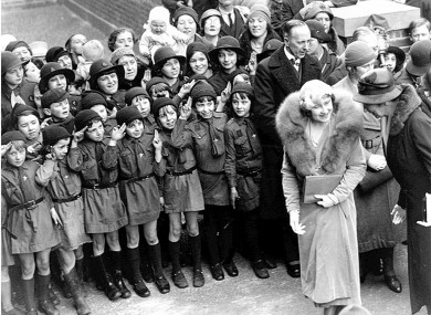 Girl Guides salute the former Queen Mother in the east end of London in 1933