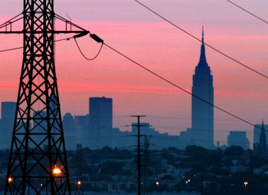 The Empire State Building towers over the skyline of a blackout-darkened New York City