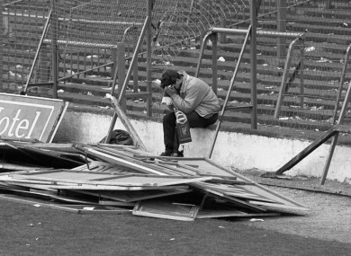 A Liverpool fan sitting on the terraces at Hillsborough after the stadium disaster where 96 fans lost their lives.