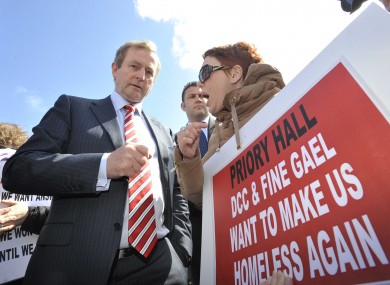 Enda Kenny speaks to former resident Stephanie Meehan at a protest last year.