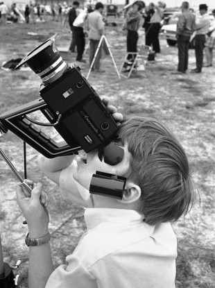 A child squints at a solar eclipse in 1970.