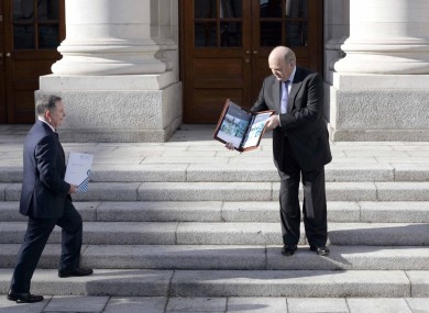 Brendan Howlin and Michael Noonan posing for photographs before today's Budget speech.