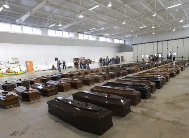 Coffins of some of the dead migrants inside a hangar at Lampedusa's airport in Italy on 5 October.