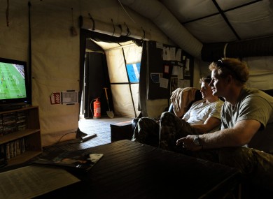 Prince Harry (right), during his time in the British Army in 2012, relaxes while playing a computer football game with his fellow Apache Helicopter Pilot Capt Simon Beattie (left), during their 12-hour VHR shift at the British controlled flight-line in Camp Bastion southern Afghanistan.