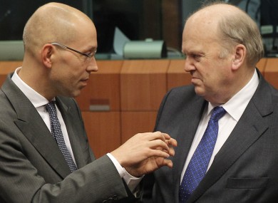 Finance Minister Michael Noonan speaking with Jorg Asmussen, Member of the Executive Board of the European Central Bank (left), during the Eurogroup meeting earlier this week.