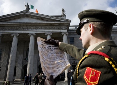 Captain Eoin Rochford poses with a copy of the Proclamation at the GPO.