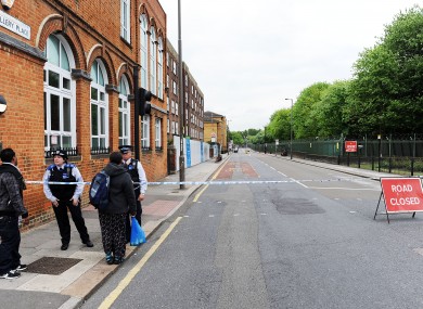 Police close off a road close to the scene were Lee Rigby was murdered.