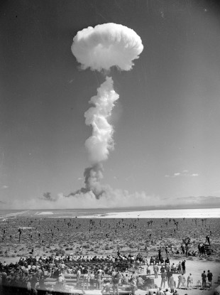 In this April 22, 1952 file photo, the mushroom cloud of an atomic bomb rises above Nevada's Yucca Flat.