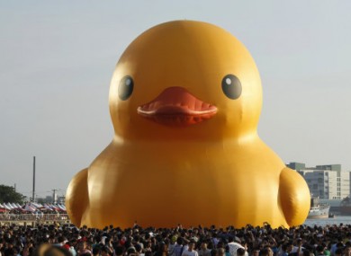 The giant yellow duck is pulled into Glory Pier in Taiwan.