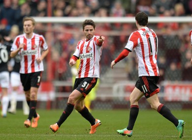 Sunderland's Fabio Borini (centre) celebrates with his team-mate Adam Johnson (right) after scoring his team's opening goal.