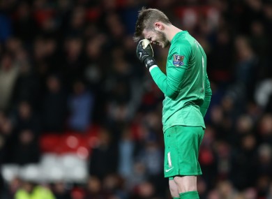 Manchester United's keeper David de Gea stands dejected after his mistake for the second goal.