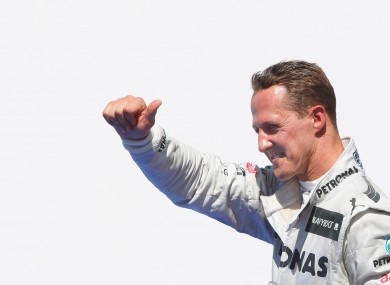 Michael schumacher celebrates a third place position at the European Grand Prix in 2012.