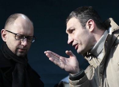 Chairman of the Ukrainian opposition party Udar (Punch), Vitali Klitschko, speaks to opposition leader Arseniy Yatsenyuk.