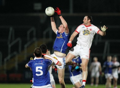 Tyrone's Ronan McNabb with Cavan's Michael Argue.