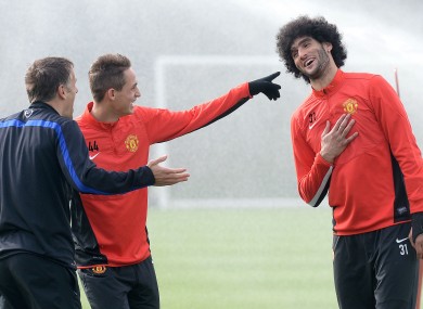 Adnan Januzaj (centre) and Phil Neville laugh at Marouane Fellaini's hair. Presumably.