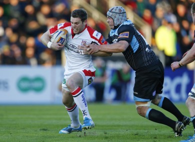 Darren Cave attempts to create an opening for Ulster.