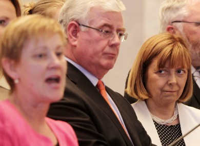 Phil Prendergast (left) speaks about her leader Eamon Gilmore (centre) as fellow MEP Emer Costello looks on.
