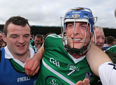 Limerick's Gavin O'Mahony is congratulated by supporters on the pitch after Sunday's game.