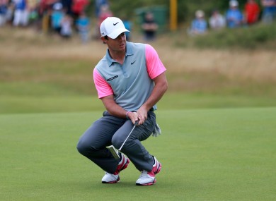 McIlroy reacts to a putt on the 11th during day four of the 2014 Open Championship.