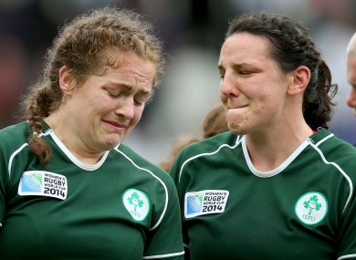 Coghlan and Paula Fitzpatrick react after defeat to France in the World Cup.
