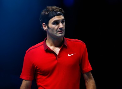 Federer waves to the disappointed crowd as he pulls out.