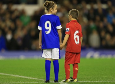 A young Everton and Liverpool fan pay tribute to the 96 people who died in the Hillsborough tragedy.