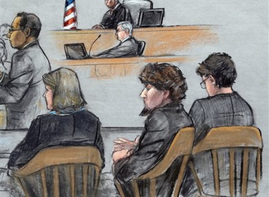 Assistant U.S. Attorney Aloke Chakravarty, left, is depicted addressing the jury as defendant Dzhokhar Tsarnaev, second from right, sits between his defense attorneys during closing arguments.