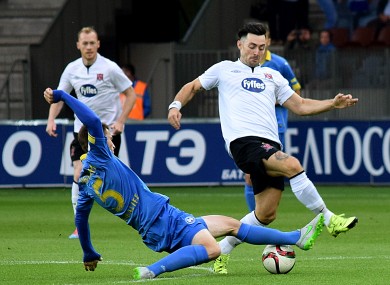 Dundalk's Richie Towell tackled by Evgeni Yablonski of BATE.