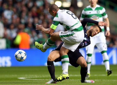 Scott Brown goes into the tackle with typical aggression.