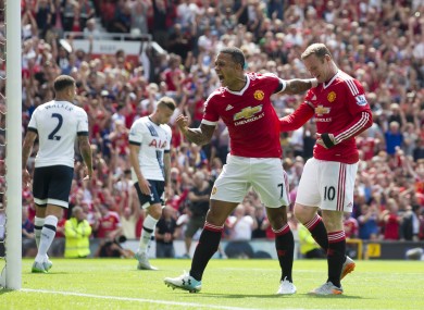 Manchester United's Wayne Rooney, right, celebrates with teammate Memphis Depay after an own goal by Tottenham's Kyle Walker.