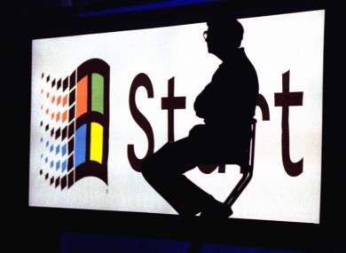 Then Microsoft chairman Bill Gates sitting in front of the now-iconic Start button during Windows 95's launch event.