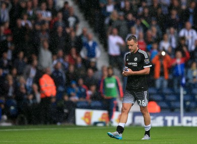Chelsea's John Terry leaves the field of play after being shown a red card by referee Mark Clattenburg.