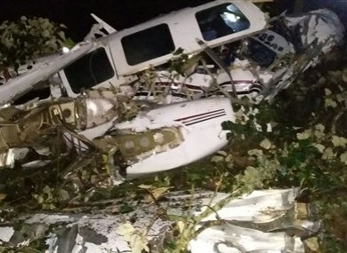 This photo released by the San Predro de los Milagros Fire Department shows the wreckage of a small plane assigned to the crew of a film starring Tom Cruise, that crashed, in a rural place of San Pedro de los Milagros, Colombia.