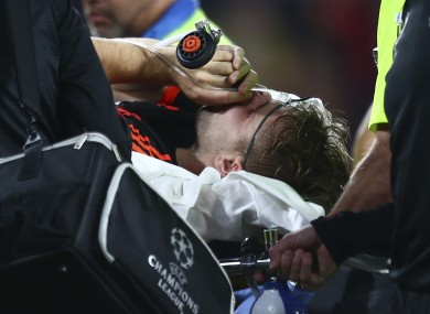 Luke Shaw is carried off the pitch after suffering a double leg break in Eindhoven.