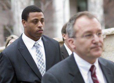 Greg Hardy (background) appearing in court after domestic violence charges against him were dismissed earlier this year.