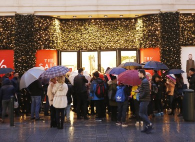 Customers queue for the Brown Thomas winter sale on Grafton Street, Dublin.