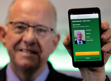 Minister for Foreign Affairs Charlie Flanagan with the passport card app.