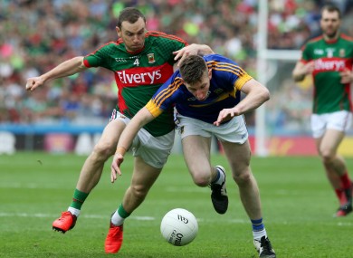 Keith Higgins in action with Jimmy Feehan.