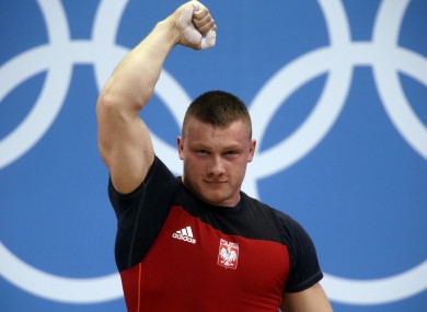 Poland's Tomasz Zielinski reacts to a successful lift at London 2012.