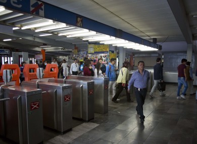 FILE: Passengers enter a metro station in Mexico City