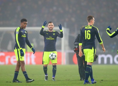 Perez (centre) and the Arsenal players at full-time.